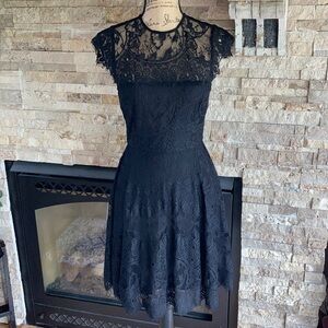 BB Dakota black lace lined mini dress w cut out in back zip closure